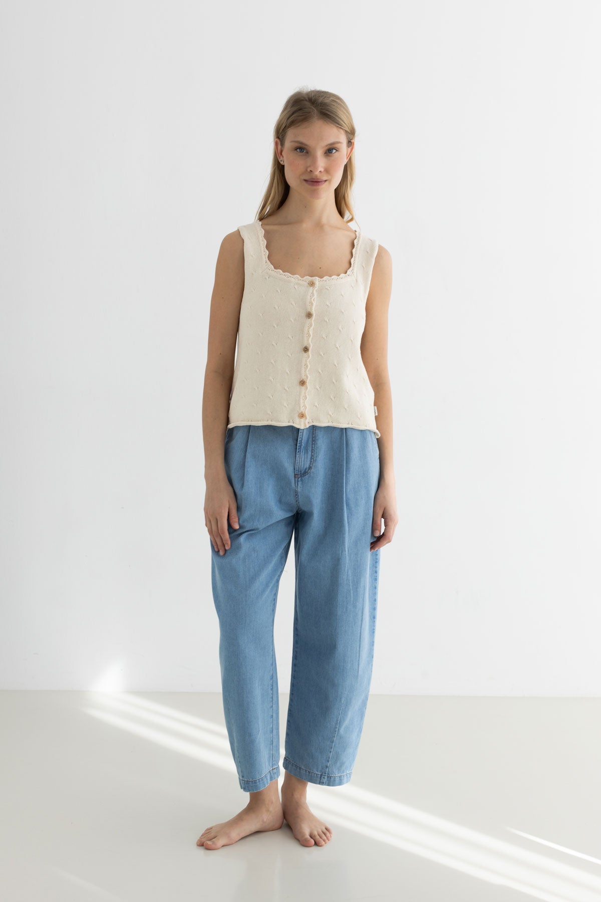 Light blue organic cotton denim pants women knit top full body view front