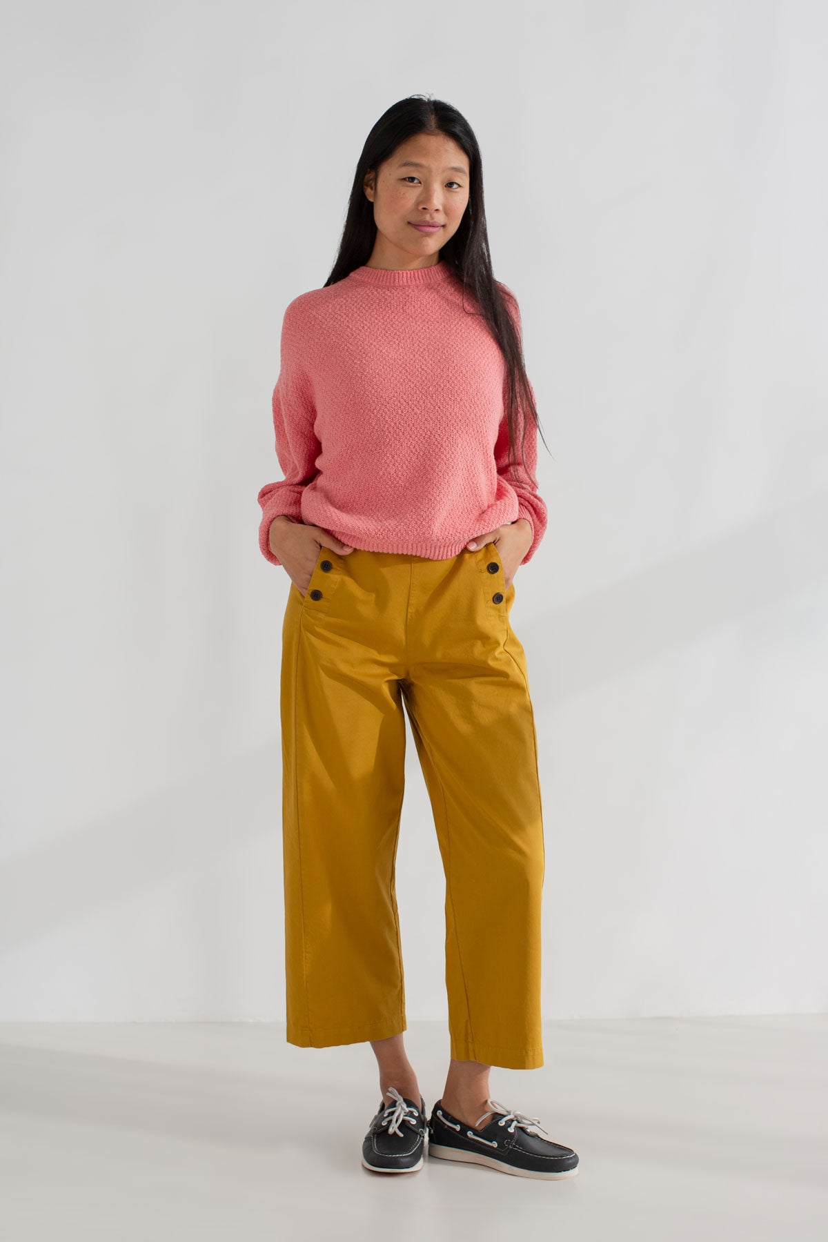 pink light weight knit women mustard pants full body view front