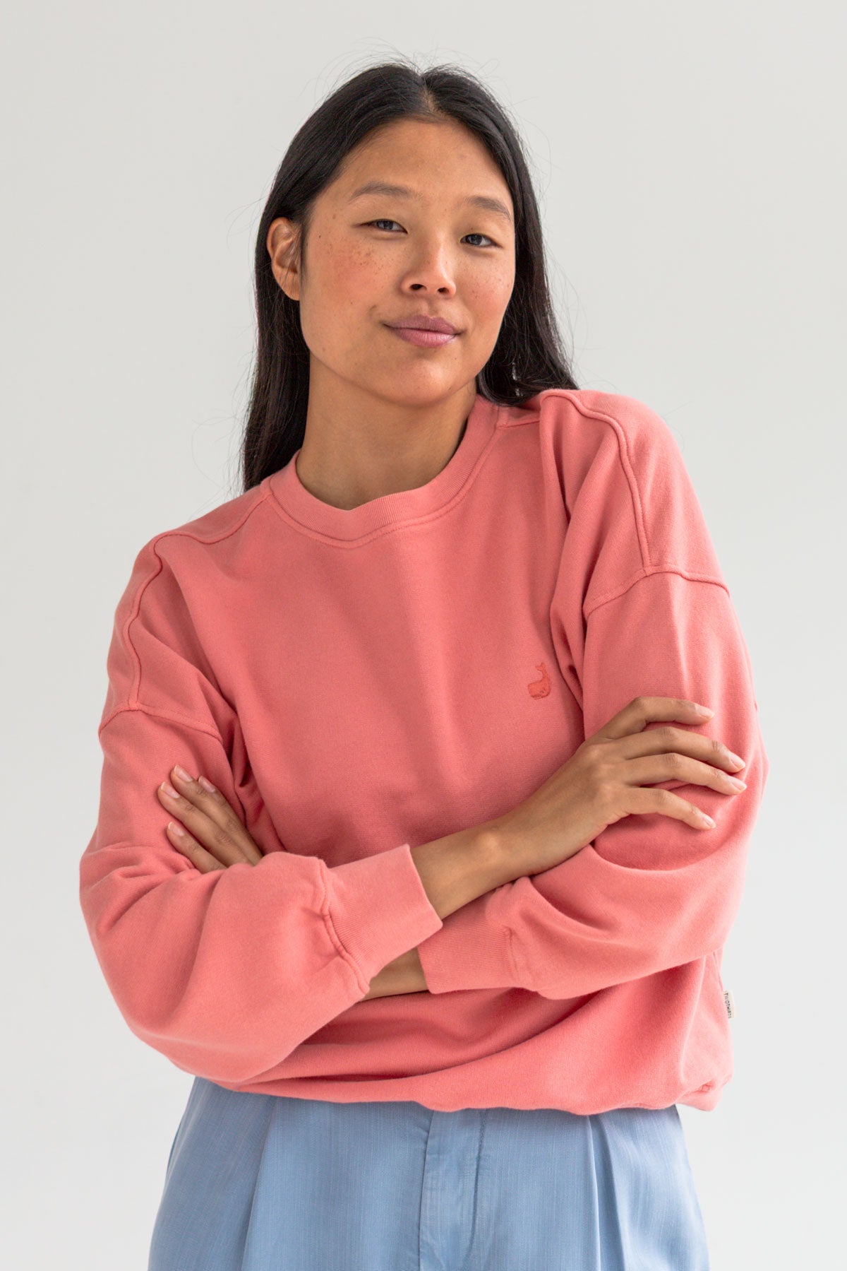 Pink American fleece sweatshirt women light blue pants wear view front