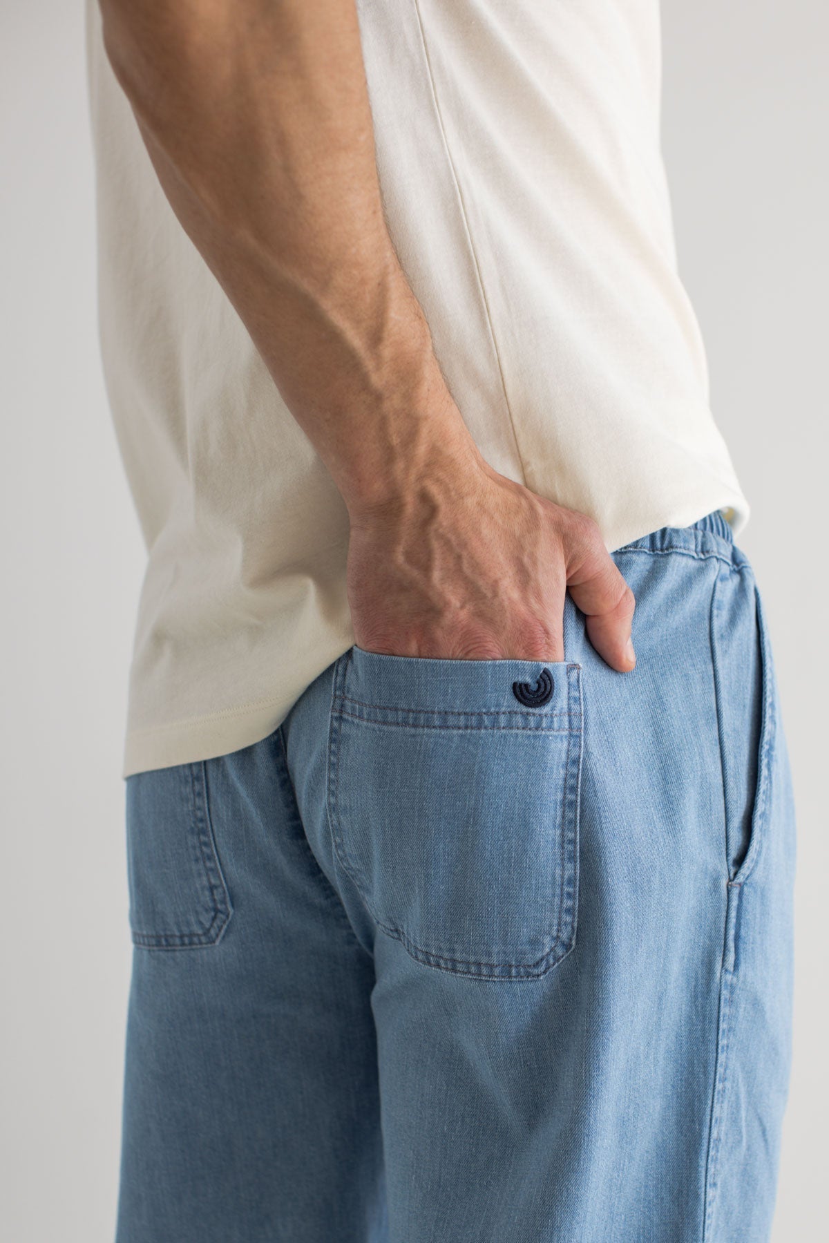 Light blue denim trousers men detail back