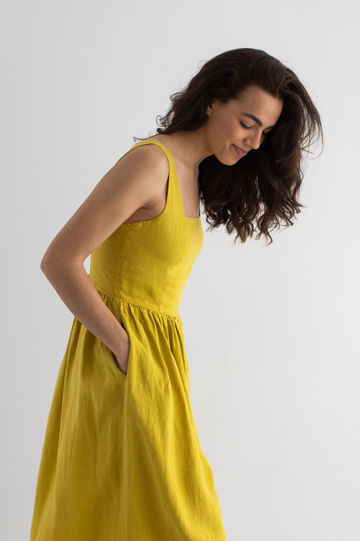 Golden green linen dress women wear view front
