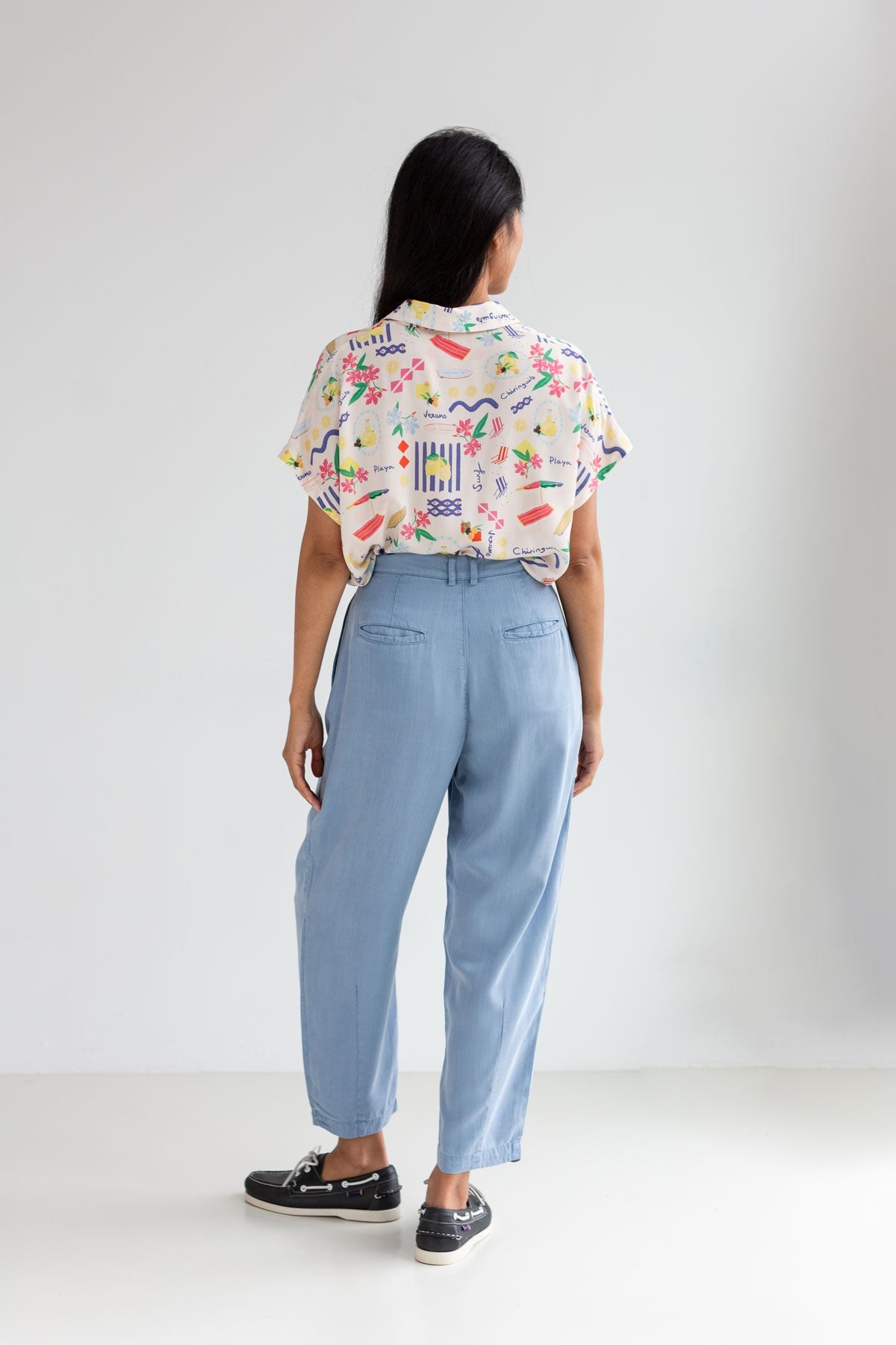Patterned light weight shirt women light blue pants full body view back