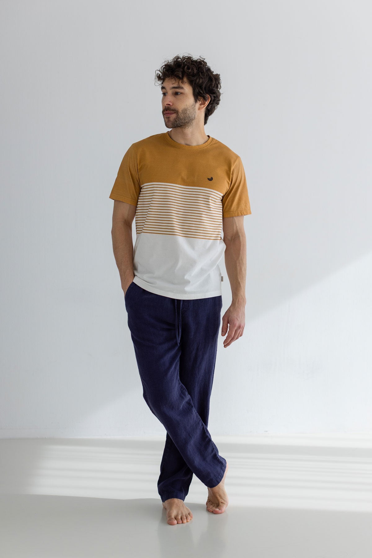 Navy blue heavy linen pants men striped tshirt full body view front