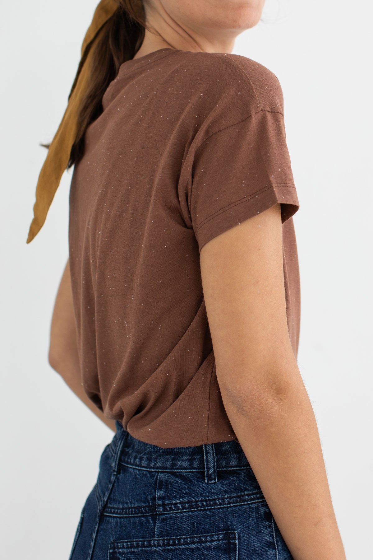 Brown tshirt navy pants women wear view side