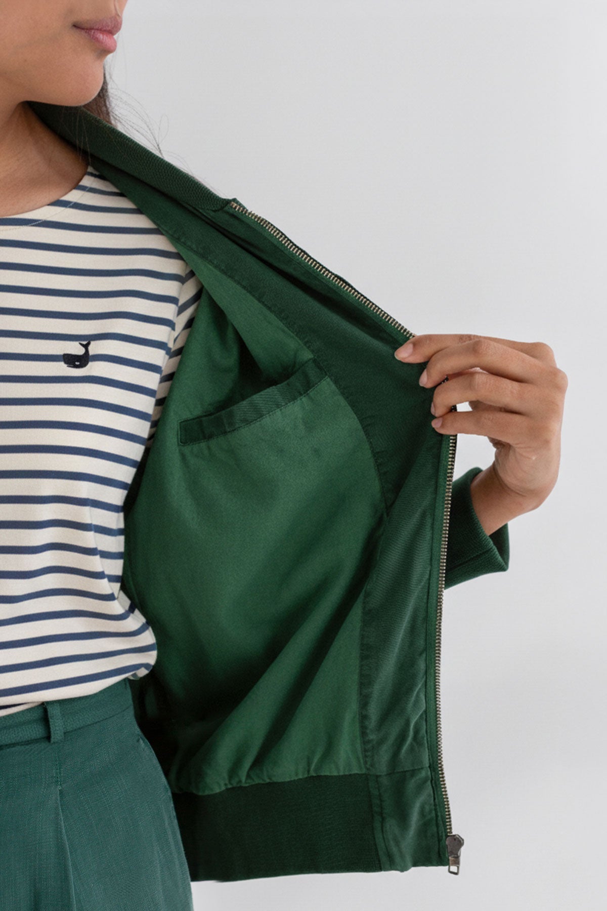 Dark green bomber jacket women striped tshirt wear view front