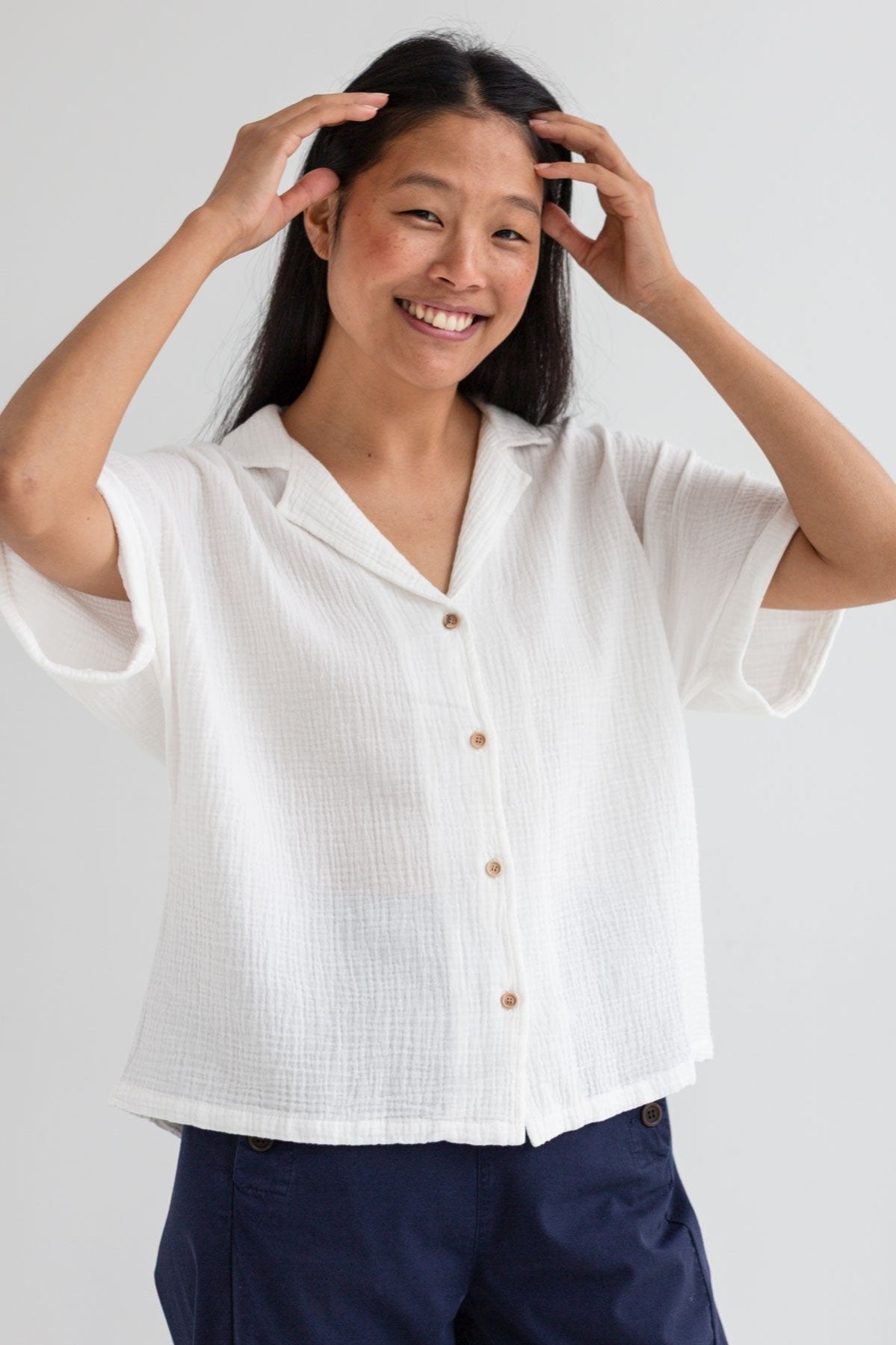 Off white muslin shirt women navy pants wear view front
