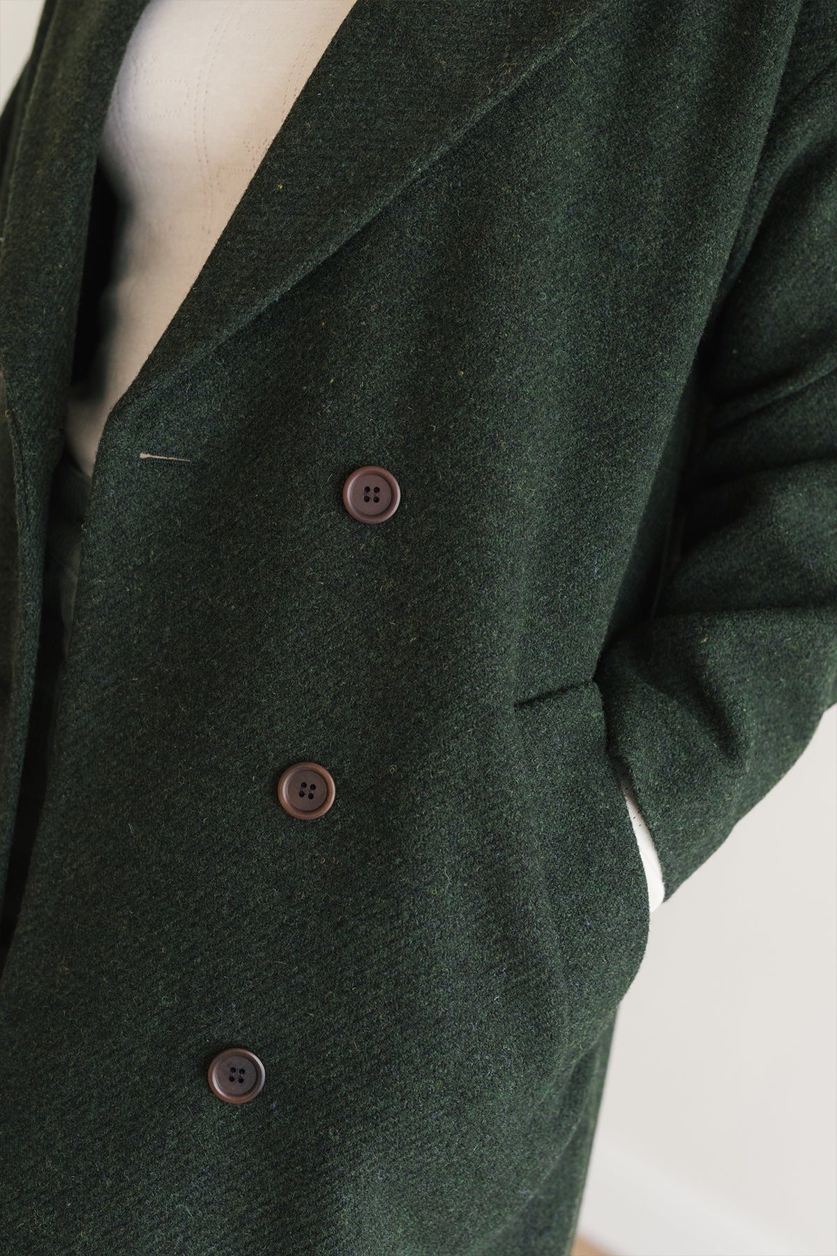 Dark green wool coat with brown buttons