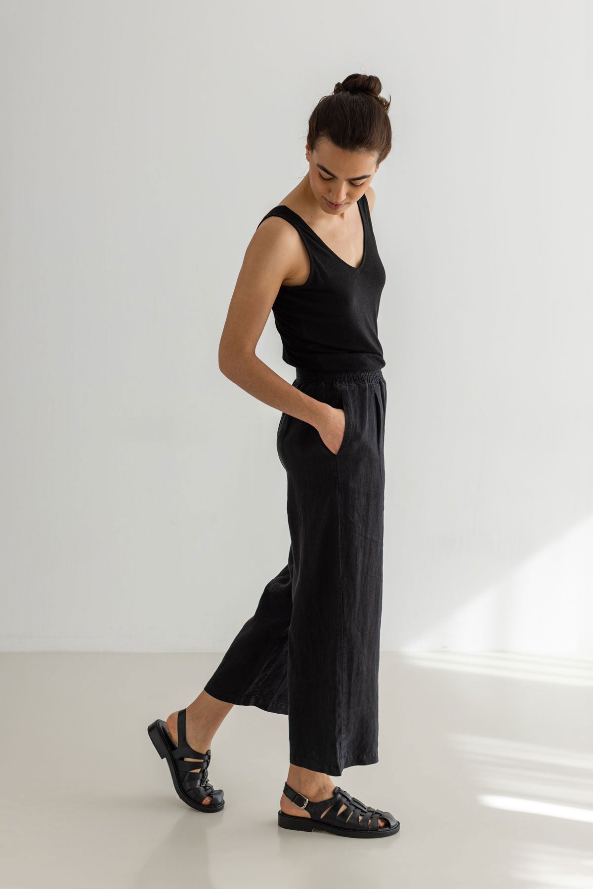 Black linen pants women black top full body view side