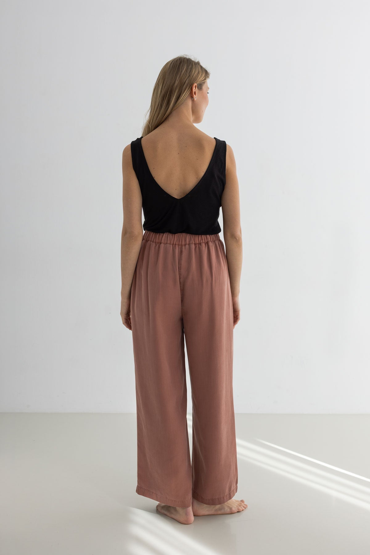 Adobe rose pants women black top full body view back