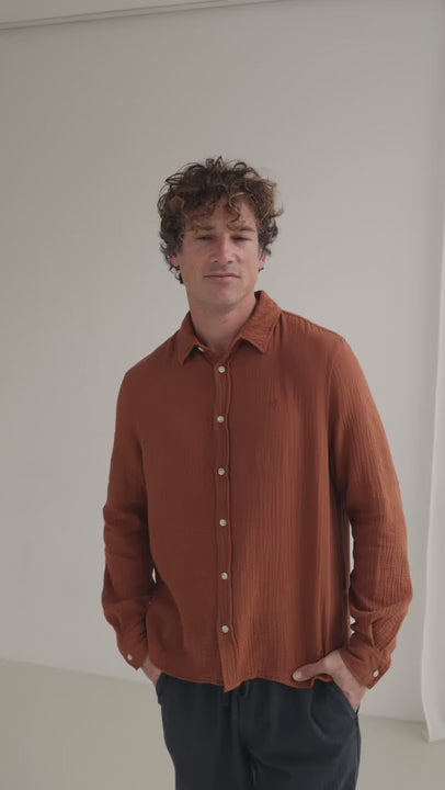 Reddish brown muslin shirt men navy pants full body view 