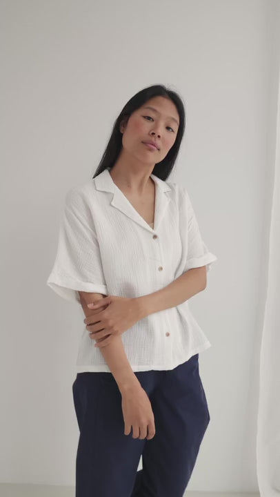 Off white muslin shirt women navy pants full body view 