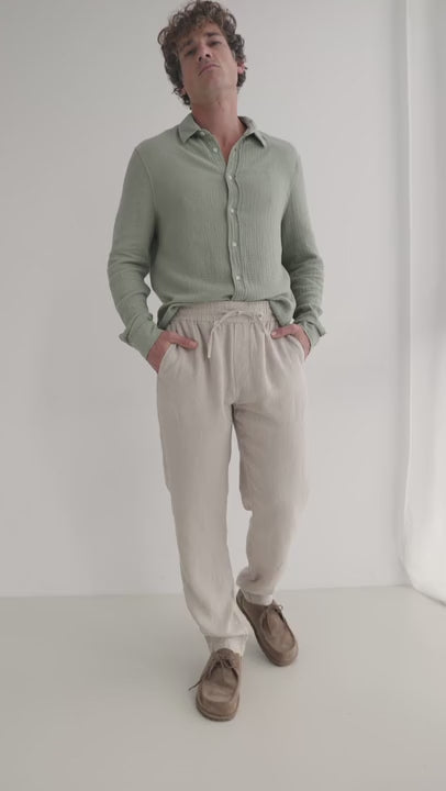 Natural heavy linen pants men light green shirt full body view 